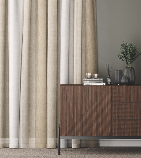 Beige and white vertical stripe curtains in contemporary room on green grey walls