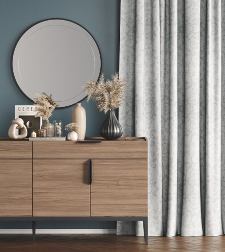 silver grey paisley pattern curtains in modern room on teal blue walls